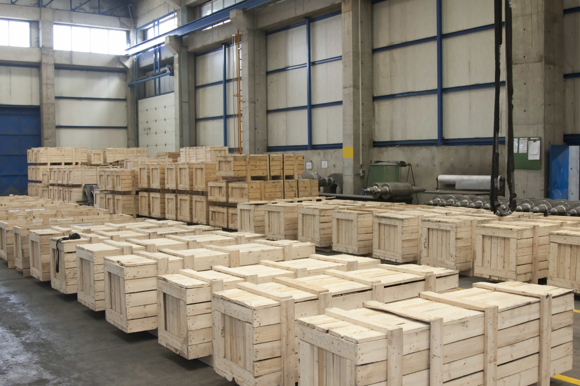 Illustrative image: wooden export crates lined up in an industrial facility